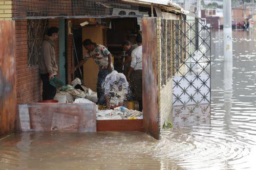 epa12834954 People remove water from their homes to a street flooded by heavy rains in Facatativa, Colombia, 19 March 2026. According to the mayor of Facatativa, Luis Carlos Casas, and local emergency agencies, heavy rains caused the Mancilla and San Rafael creeks to overflow and feed the Botello River, leading to severe flooding that affected more than...