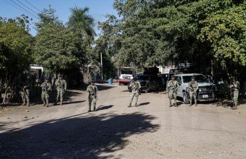 epa12835152 Members of the Mexican Army secure the area after conducting an operation in the town of Valle Escondido, Sinaloa state, Mexico, 19 March 2026. Mexico’s Security Cabinet reported an operation in Sinaloa that left 11 suspected criminals dead and a daughter of El Mayo Zambada, the leader of the Sinaloa Cartel currently imprisoned in the United...