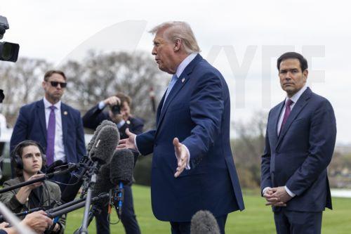 epa12837370 US President Donald J. Trump (C), with Secretary of State Marco Rubio (R), responds to a question from the news media as he walks to board Marine One on the South Lawn of the White House in Washington, DC, USA, 20 March 2026.  EPA/SHAWN THEW / POOL