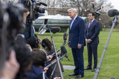 epa12837376 US President Donald J. Trump (C), with Secretary of State Marco Rubio (R), responds to a question from the news media as he walks to board Marine One on the South Lawn of the White House in Washington, DC, USA, 20 March 2026.  EPA/SHAWN THEW / POOL