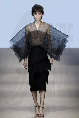 epa12838244 A model takes to the catwalk with designs of Angel Schlesser during the Mercedes-Benz Fashion Week Madrid (MBFWMadrid), in Madrid, Spain, 21 March 2026.  EPA/J.J.Guillen