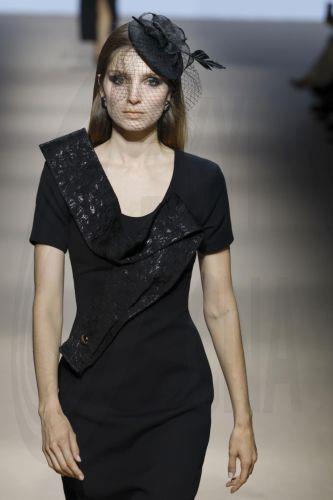epa12838247 A model takes to the catwalk with designs of Angel Schlesser during the Mercedes-Benz Fashion Week Madrid (MBFWMadrid), in Madrid, Spain, 21 March 2026.  EPA/J.J.Guillen