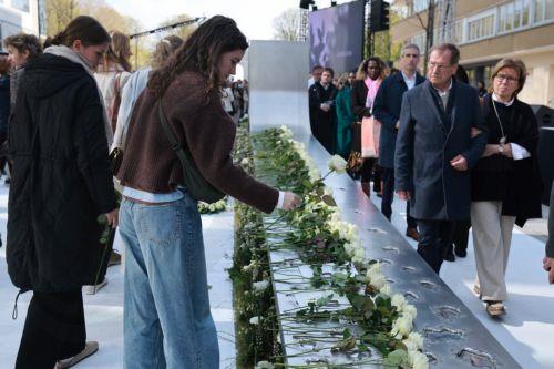 epa12841112 Members of the public attend a memorial ceremony on the 10th anniversary of the Brussels attacks in Brussels, Belgium, 22 March 2026. Brussels was struck by coordinated suicide bombings on 22 March 2016, claimed by the so-called Islamic State. Two blasts detonated in the departure hall of Zaventem Airport and a third at Maelbeek metro station in...