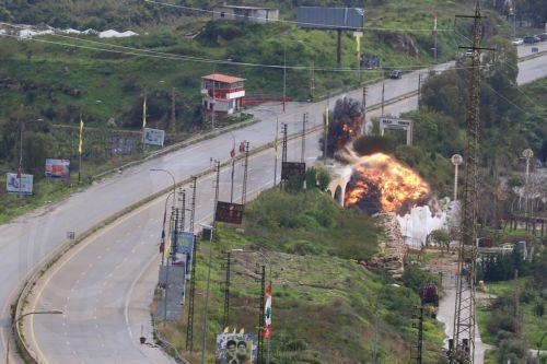 epa12841450 Smoke and flames rise after an Israeli strike targeting the Qasmiya Bridge near Tyre, in southern Lebanon, 22 March 2026. According to the Lebanese National News Agency (NNA), the Israeli military carried out an airstrike on the Qasmiya Bridge, a key crossing point over the Litani River connecting southern Lebanon to the north.  EPA/STRINGER