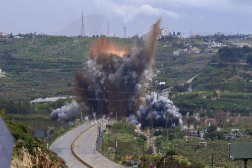 epa12841453 Smoke and flames rise after an Israeli strike targeting the Qasmiya Bridge near Tyre, in southern Lebanon, 22 March 2026. According to the Lebanese National News Agency (NNA), the Israeli military carried out an airstrike on the Qasmiya Bridge, a key crossing point over the Litani River connecting southern Lebanon to the north.  EPA/STRINGER