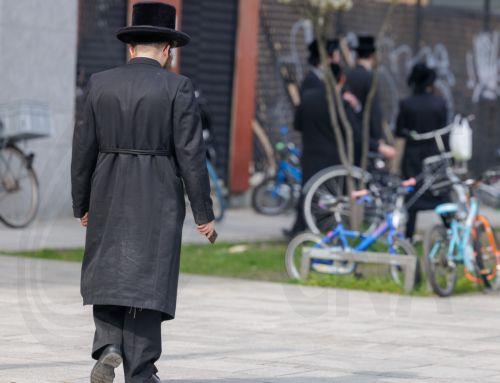 epa12843695 A member of the Jewish community walks in Antwerp, Belgium, 23 March 2026. The Belgian government announced on 16 March that it will deploy military personnel to reinforce the Federal Police to protect a number of synagogues and Jewish schools across the country following a series of antisemitic attacks in Europe.  EPA/OLIVIER MATTHYS