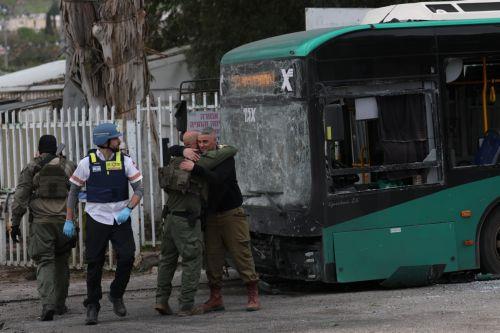 epa12843881 Israeli security, rescue, and paramedics at the scene of a direct hit by a missile fired by Hezbollah in the northern  Israeli city of Kiryat Shmona, 23 March 2026. The Israeli military stated it is conducting strikes across Lebanon targeting Hezbollah infrastructure and personnel.  EPA/ATEF SAFADI
