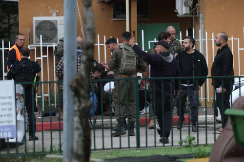 epa12843891 Israeli security, rescue, and paramedics at the scene of a direct hit by a missile fired by Hezbollah in the northern  Israeli city of Kiryat Shmona, 23 March 2026. The Israeli military stated it is conducting strikes across Lebanon targeting Hezbollah infrastructure and personnel.  EPA/ATEF SAFADI