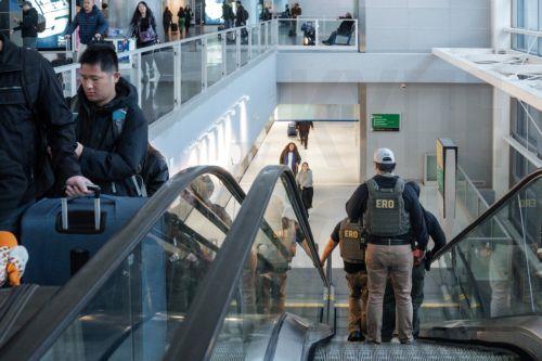 epa12844114 US Enforcement and Removal Operations (ERO) agents patrol Terminal 8 of the John F. Kennedy International Airport, amid congestion caused by the Department of Homeland Security (DHS) shutdown, in the Queens of borough of New York, New York, USA, 23 March 2026. ICE agents have begun deploying to major US airports to assist the Transportation...