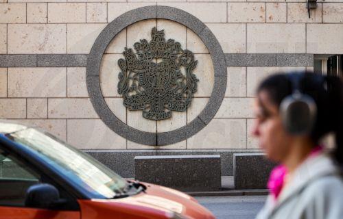 epa12860131 A woman walks past the British Embassy building in Moscow, Russia, 30 March 2026. The Second Secretary of the British Embassy in Moscow, Jance Gerardus, has been ordered to leave Russia within two weeks following the revocation of his accreditation by the Russian Federal Security Service (FSB) over espionage allegations.  EPA/MAXIM SHIPENKOV