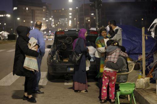epa12866511 A family packs their belongings before returning to devastated areas of the southern suburb of Beirut, Lebanon, 02 April 2026. Adverse weather, heavy rain, and a shortage of tents forced some residents to return to their homes despite Israeli warnings and ongoing airstrikes. According to the UN, more than 1.1 million people have been displaced...