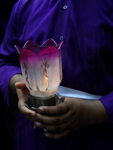 epa12866795 A Christian carries a lamp during Good Friday at Mother House in Kolkata, India, 03 April 2026. Good Friday is a religious holiday observed primarily by adherents to Christianity commemorating the crucifixion of Jesus and his death at Golgotha. The holiday is observed during Holy Week as part of the Paschal Triduum on the Friday preceding Easter...