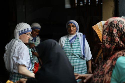 epa12866797 People receive food donations during Good Friday near Mother House in Kolkata, India, 03 April 2026. Good Friday is a religious holiday observed primarily by adherents to Christianity commemorating the crucifixion of Jesus and his death at Golgotha. The holiday is observed during Holy Week as part of the Paschal Triduum on the Friday preceding...