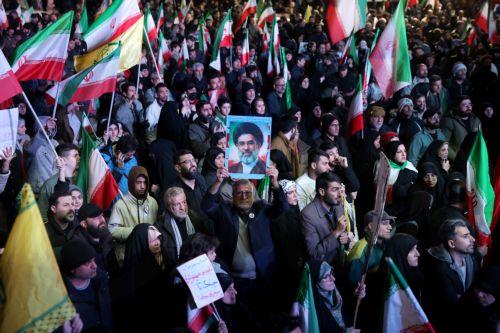 epa12874356 Iranians wave flags during a demonstration following the announcement of a two-week ceasefire at Enghelab Square in Tehran, Iran, 08 April 2026. Iran and the USA agreed to the two-week truce to halt military operations and keep the Strait of Hormuz open for oil and gas shipments, with formal peace talks set to begin in Islamabad on 10 April. ...