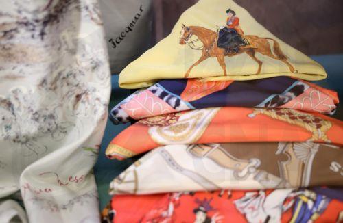 epa12877227 Scarves worn by Britain’s Queen Elizabeth II are displayed at the exhibition 'Queen Elizabeth II: Her Life in Style' at The King’s Gallery, Buckingham Palace in London, Britain, 09 April 2026. The exhibition features 300 pieces of clothing and accessories worn by late Britain’s Queen Elizabeth and runs from 10 April to 18 October 2026.  EPA/NEIL...