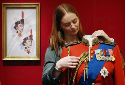 epa12877252 A ceremonial tunic of Britain’s Queen Elizabeth II is displayed at the exhibition 'Queen Elizabeth II: Her Life in Style' at The King’s Gallery, Buckingham Palace in London, Britain, 09 April 2026. The exhibition features 300 pieces of clothing and accessories worn by late Britain’s Queen Elizabeth and runs from 10 April to 18 October 2026. ...