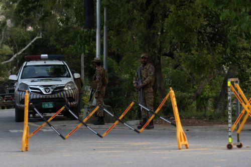 epa12877630 Pakistani security officials man a checkpoint as security has been intensified ahead of the visit of US and Iranian delegations in Islamabad, Pakistan, 09 April 2026. Prime Minister Shehbaz Sharif said US and Iranian delegations will visit Islamabad for peace talks following a Middle East ceasefire, with Iranian President Masoud Pezeshkian...
