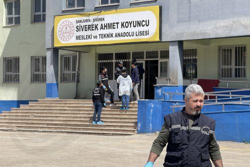 epa12888863 Turkish police investigators work at the site of a shooting that took place in a school in Siverek district of Sanliurfa, Turkey, 14 April 2026. At least 16 people have been injured after a former student opened fire at the Ahmet Koyuncu Vocational and Technical Anatolian High School in Siverek district, before killing himself with the same...