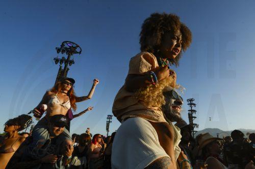 epaselect epa12901558 Festival goers dance as US electronic artist Major Lazer performs during day three of weekend two at the 2026 Coachella Valley Music and Arts Festival at the Empire Polo Club in Indio, California, USA, 19 April 2026.  EPA/CHRIS TORRES