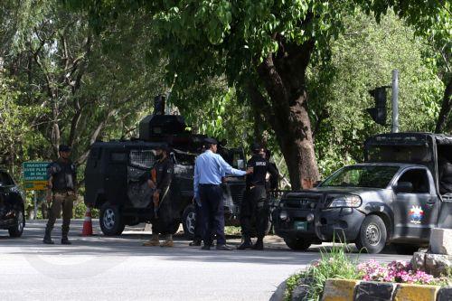 epa12902511 Pakistani security officials guard a road ahead of the expected arrival of a US delegation in Islamabad, Pakistan, 20 April 2026. As the ceasefire deadline nears, US negotiators are returning to Islamabad for a second round of talks, despite an Iranian Foreign Ministry spokesperson stating that Tehran has no plans to participate.  EPA/SOHAIL...