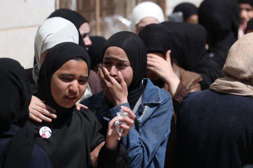 epa12907261 Relatives of Palestinian teenager Aws Hamdi Al-Naasan mourn during his funeral in the village of Al-Mughayyir, east of the West Bank city of Ramallah, 22 April 2026. According to the Palestinian news agency Wafa, two Palestinians were killed by Israeli settlers' gunfire during an attack on the village of al-Mughayyir, east of Ramallah, on 21...