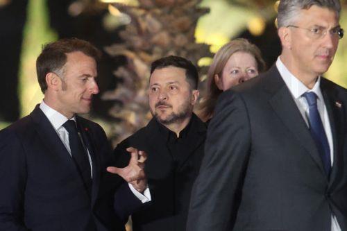 epa12909690 (L-R) French President Emmanuel Macron, President of Ukraine Volodymyr Zelensky and Croatian Prime Minister Andrej Plenkovic walk for a family picture during an informal meeting of EU Heads of State or Government in Agia Napa, Cyprus, 23 April 2026. EU leaders are expected to address current geopolitical developments and Europe's response to...