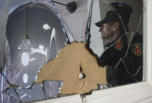 epa12916866 A local man reflected in a broken mirror at the site of the Russian strike on a residential area in Odesa, Ukraine, 27 April 2026, amid the Russian invasion. At least 14 people were injured, including two children, after an overnight Russian attack on Odesa, according to the head of the Odesa regional military administration, Oleg Kiper. ...