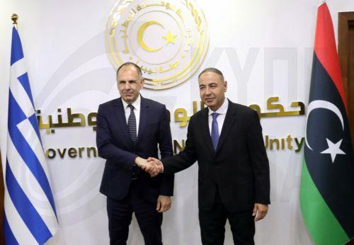 epa12917047 Libya's acting Foreign Minister Taher Al-Baour (R) shakes hands with Greek Foreign Minister George Gerapetritis (L) during their meeting in Tripoli, Libya, 27 April 2026.  EPA/STRINGER
