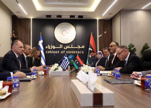 epa12917049 Libya's acting Foreign Minister Taher Al-Baour (R) meets with Greek Foreign Minister George Gerapetritis (L) in Tripoli, Libya, 27 April 2026.  EPA/STRINGER