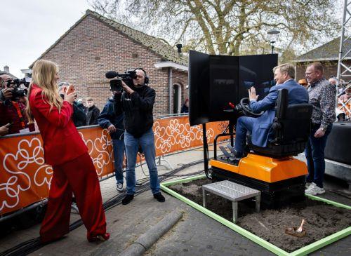 epa12917054 Princess Catharina-Amalia of the Netherlands (L) takes a photo of her father, King Willem-Alexander (2-R), with a Polaroid camera during the celebration of King's Day, in Dokkum, the Netherlands, 27 April 2026. The national holiday of 'Koningsdag' (King's Day) marks the birthday of the Dutch monarch.  EPA/SEM VAN DER WAL / POOL