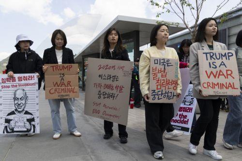 epa12920808 South Korean protesters hold banners and a mugshot of Israeli Prime Minister Benjamin Netanyahu during a demonstration against U.S. and Israeli military actions in Iran outside the U.S. embassy in Seoul, South Korea, 29 April 2026.  EPA/JEON HEON-KYUN