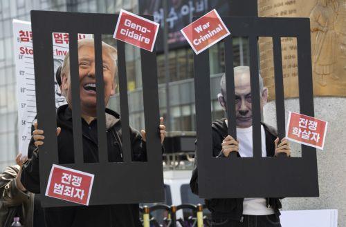 epa12920810 South Korean protesters wearing masks of U.S. President Donald Trump and Israeli Prime Minister Benjamin Netanyahu perform during a demonstration against U.S. and Israeli military actions in Iran outside the U.S. embassy in Seoul, South Korea, 29 April 2026.  EPA/JEON HEON-KYUN