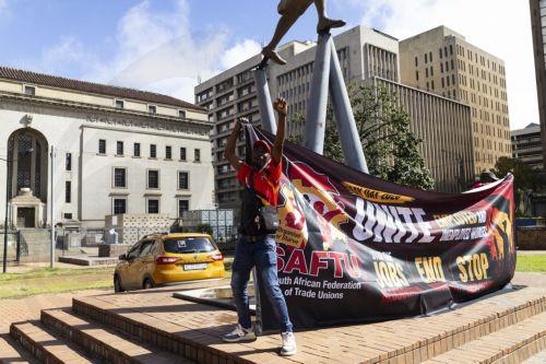 epa12926146 Members of the South African Federation of Trade Unions gather during a May Day event held in downtown Johannesburg, South Africa, 01 May 2026. Members of trade unions gathered to bring attention to job losses in South Africa due to economic conditions. Official unemployment figures are at 33 percent of the adult population, meaning 8 million...