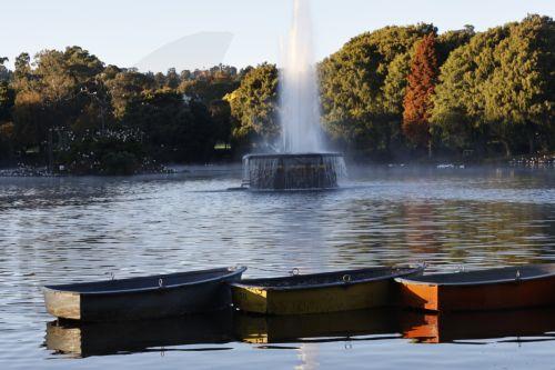 epa12929333 The autumn sun rises over rowing boats on Zoo Lake in Johannesburg, South Africa, 03 May 2026. The lake is a popular area for walkers, runners, and weekend picnics.  EPA/Kim Ludbrook