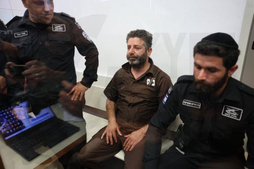 epa12929419 Saif Abu Keshek (C), a member of the Global Sumud Flotilla, arrives to attend his trial for a remand extension at the Ashkelon Magistrate's Court in Ashkelon, Israel, 03 May 2026. Abu Keshek along with Thiago Avila were arrested on 02 May off the island of Crete, according to the organization. According to the Israeli Ministry of Foreign...
