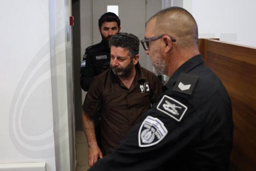 epa12929423 Saif Abu Keshek (C), a member of the Global Sumud Flotilla, arrives to attend his trial for a remand extension at the Ashkelon Magistrate's Court in Ashkelon, Israel, 03 May 2026. Abu Keshek along with Thiago Avila were arrested on 02 May off the island of Crete, according to the organization. According to the Israeli Ministry of Foreign...