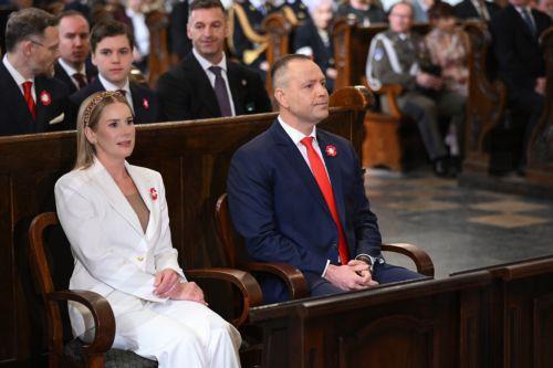 epa12929431 Polish President Karol Nawrocki (R) and First Lady Marta Nawrocka (L) attend a Holy Mass for the Homeland as part of 3rd May Constitution Day celebrations at the Archcathedral of St. John the Baptist in Warsaw, Poland, 03 May 2026The 03 May National Holiday commemorates the adoption of the 03 May Constitution in 1791. This document was the...