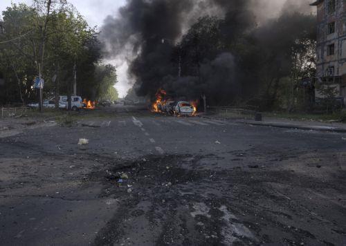 epa12934989 A handout photo made available by the press service of the 93rd Kholodnyi Yar Separate Mechanized Brigade of Ukrainian Armed Forces shows a damaged road and cars burning in the aftermath of a Russian airstrike in Kramatorsk, Donetsk region, Ukraine, 05 May 2026, amid the ongoing Russian invasion. Several people died and a dozens were injured...