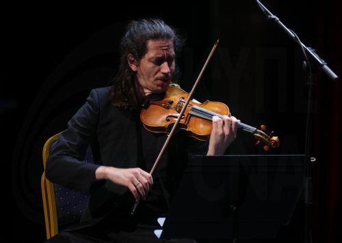epa12935041 A member of the Spanish Gerhard Quartet Jesus Sebastia Miralles performs during the 15th International Cultural Festival of Symphonic Music at the Algiers Opera in Algiers, Algeria, 5 May 2026. The festival runs from 30 April to 7 May and features 21 participating countries with the Czech Republic serving as the guest of honor.  EPA/MOHAMED...