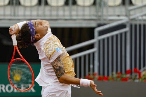 epa12947049 Mattia Bellucci of Italy in action during his men’s singles round of 32 match against Martin Landaluce of Spain at the Italian Open tennis tournament in Rome, Italy, 11 May 2026.  EPA/FABIO FRUSTACI