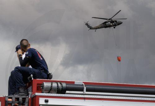 epa12947774 A US Army helicopter crew battles a wildfire in the Everglades near Pembroke Pines, Florida, United States, 11 May 2026. Florida is facing an active wildfire season, with the Max Road Fire burning thousands of acres across parts of Broward and Miami-Dade counties and smoke affecting nearby communities.  EPA/CRISTOBAL HERRERA-ULASHKEVICH