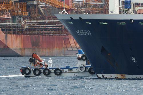 epa12947799 The MV Hondius cruise ship, affected by several hantavirus cases, remains anchored inside the Port of Granadilla de Abona in Tenerife, Spain, 11 May 2026. Authorities prepared to disembark the last passengers, who were expected to be repatriated from Tenerife South Airport.  EPA/RAMON DE LA ROCHA