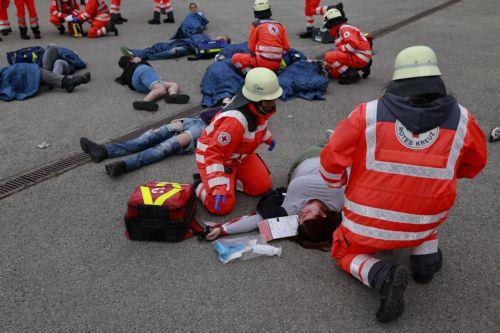 epa12947896 Members of the Bavarian Red Cross and role players participate in an exercise demonstrating the organization’s complex emergency response system in Munich, Germany, 11 May 2026. The drill involved more than 75 emergency responders and role players and simulated a mass casualty incident caused by a crowd accident and the leak of an initially...
