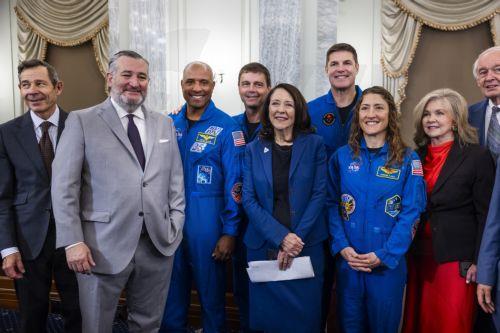epa12950470 Artemis II astronauts, including Pilot Victor Glover (L) Commander Reid Wiseman (C-L), Mission Specialist Jeremy Hansen (C-R) and Mission Specialist Christina Koch (R), greet US Senators in the Russell Senate Office Building in Washington, DC, USA, 12 May 2026. The four Artemis astronauts led NASA's first crewed space mission to orbit the moon...