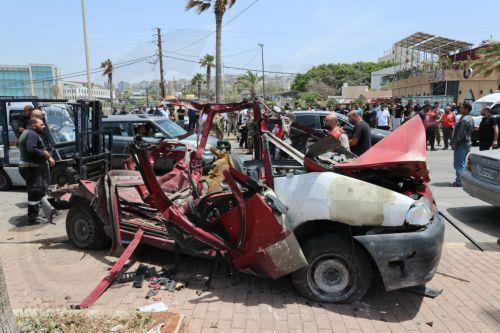 epa12952890 Lebanese rescuers and army soldiers inspect the wreckage of a vehicle that was hit in an Israeli strike in the southern coastal city of Sidon, Lebanon, 13 May 2026.  EPA/WAEL HAMZEH