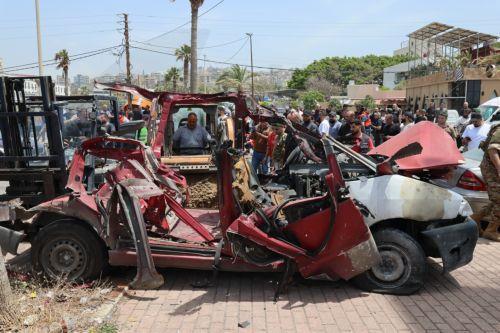 epa12952892 Lebanese rescuers and army soldiers inspect the wreckage of a vehicle that was hit in an Israeli strike in the southern coastal city of Sidon, Lebanon, 13 May 2026.  EPA/WAEL HAMZEH