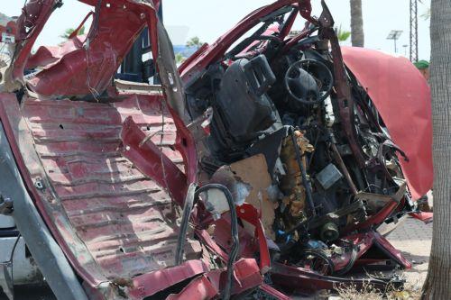 epa12952895 Lebanese rescuers and army soldiers inspect the wreckage of a vehicle that was hit in an Israeli strike in the southern coastal city of Sidon, Lebanon, 13 May 2026.  EPA/WAEL HAMZEH