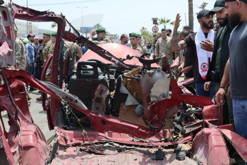 epa12952897 Lebanese rescuers and army soldiers inspect the wreckage of a vehicle that was hit in an Israeli strike in the southern coastal city of Sidon, Lebanon, 13 May 2026.  EPA/WAEL HAMZEH