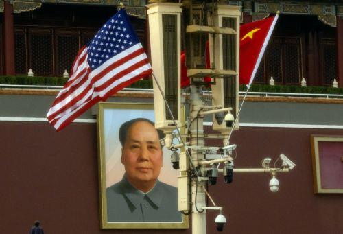 epa12952920 US (L) and Chinese flags flutter next to a portrait of Chinese communist leader and founder of the People's Republic of China Mao Zedong at Tiananmen Square, in Beijing, China, 13 May 2026. US President Donald Trump is due to arrive in Beijing for a high-stakes state visit running through 15 May, marking his first return to the mainland since...