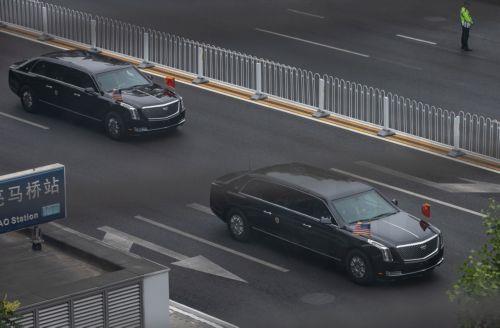 epa12958692 Vehicles adorned with China's and US national flags as part of US President Donald Trump's motorcade leave the hotel and drives to the airport, in Beijing, China, 15 May 2026. US President Trump flew to Beijing for a high-stakes state visit running 13 May through 15 May, marking his first return to the mainland since 2017.  EPA/JESSICA LEE